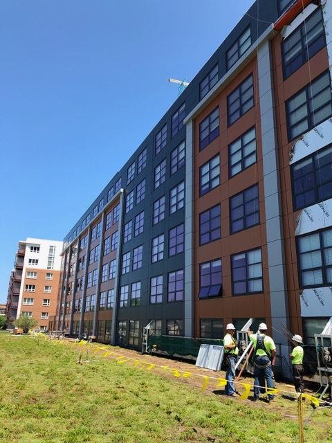 Professional crew providing expert commercial roofing services for large buildings.